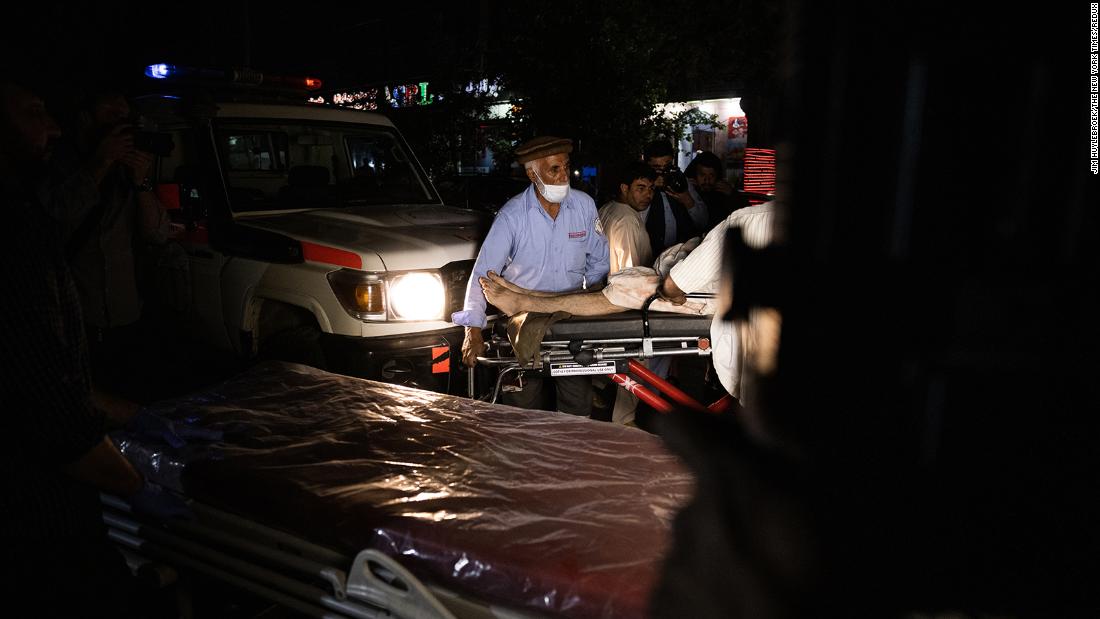 An injured person arrives on a stretcher at a Kabul hospital on Thursday.