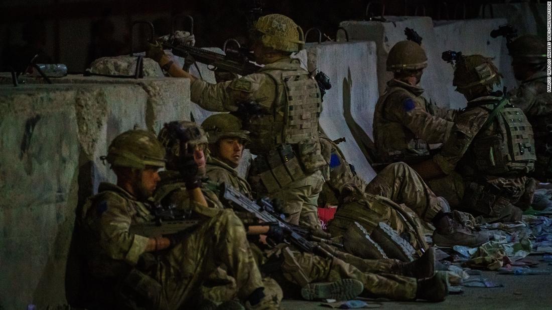 British soldiers secure the perimeter outside the Baron Hotel in Kabul on Thursday.