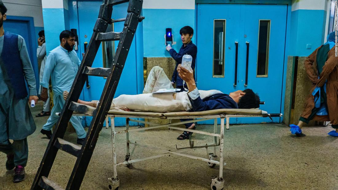 An injured patient waits to be transported to another floor at the Wazir Akbar Khan Hospital in Kabul.