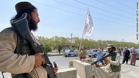 On August 17, 2021, Taliban fighters stood guard at the entrance to the Ministry of Interior in Kabul. 