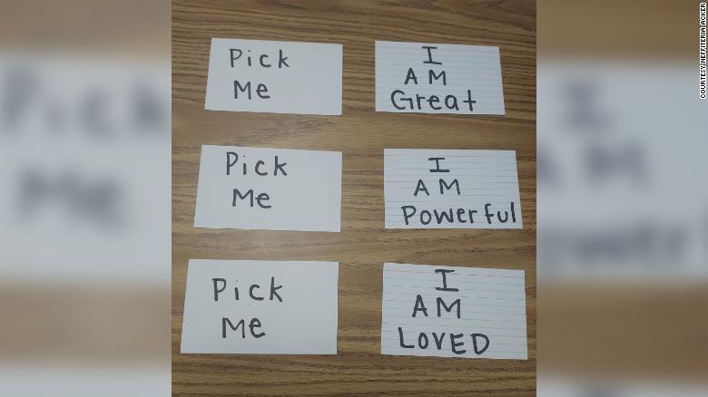 When students can't think of any affirmations, Neffiteria Acker offers them cards with positive messages written on them. 