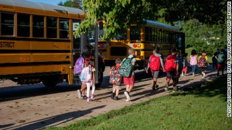 Students arrive for their first day of school on Wednesday, Aug. 25, 2021 at Westlake Elementary School in Battle Creek, Michigan.