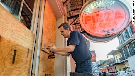 Michael Richard of Creole Cuisine Restaurant Concepts boards up Crescent City Pizza, the French Quarter, on Saturday, Aug. 28, 2021, before Hurricane Ida makes landfall.  