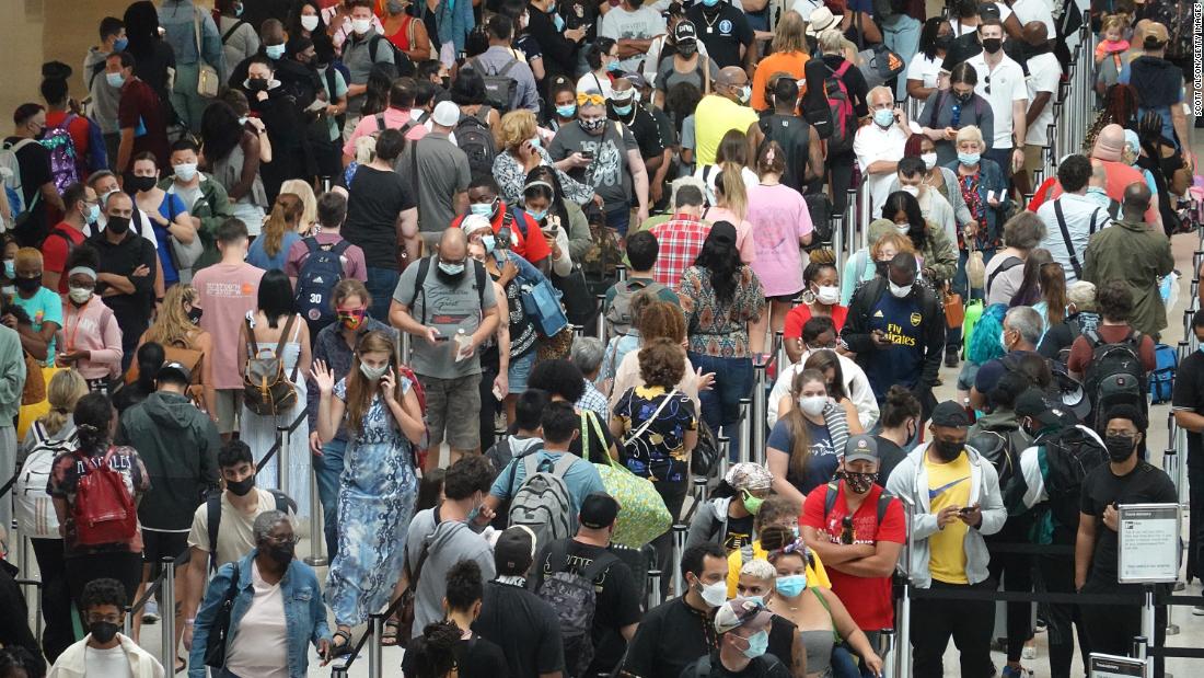 People stand in line at the Louis Armstrong New Orleans International Airport on August 28. Many residents were evacuating the area ahead of Hurricane Ida.