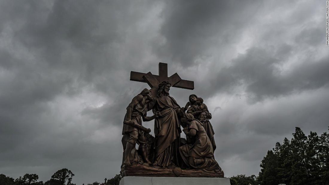 Storm clouds pass over a cemetery in New Orleans on Sunday.
