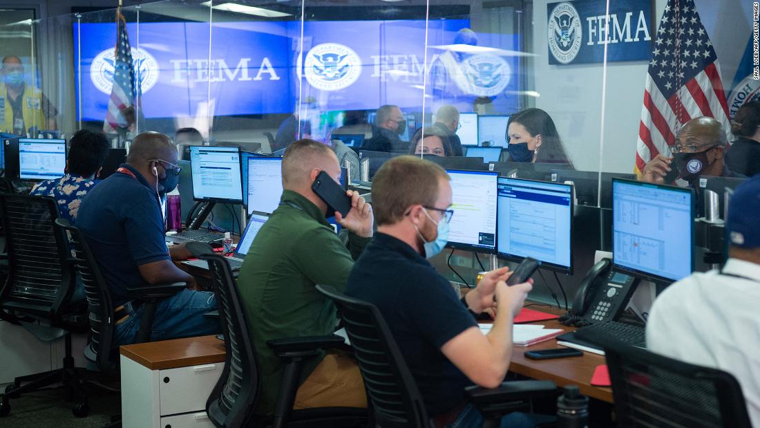 People work inside the Federal Emergency Management Agency&#39;s headquarters in Washington, DC, on August 29.