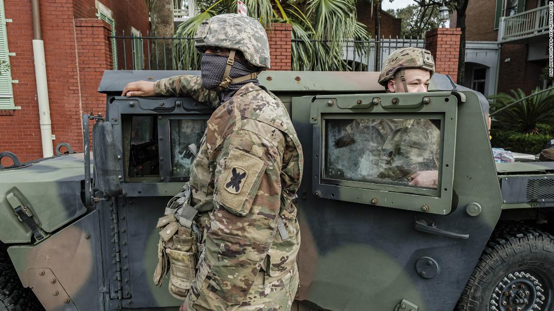 Members of the Louisiana National Guard help with recovery efforts in New Orleans on August 30.