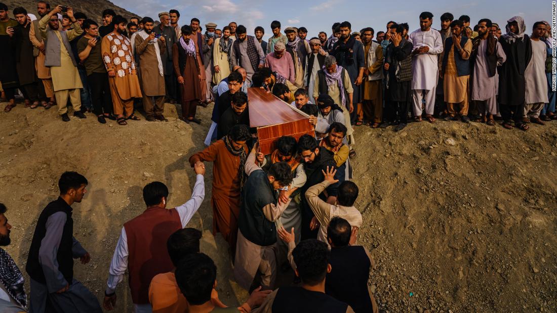 A casket is brought to a grave site at a mass funeral in Kabul on August 30. &lt;a href=&quot;https://www.cnn.com/2021/08/29/asia/afghanistan-kabul-evacuation-intl/index.html&quot; target=&quot;_blank&quot;&gt;Ten members of one family&lt;/a&gt; — including seven children — were dead after a US drone strike targeted a vehicle in a residential neighborhood of Kabul, a relative of the dead told CNN. The United States carried out what it called a defensive airstrike in Kabul, targeting a suspected ISIS-K suicide bomber who posed an &quot;imminent&quot; threat to the airport, US Central Command said. The Pentagon has said the strike resulted in secondary explosions and that those explosions may have been what killed the civilians.