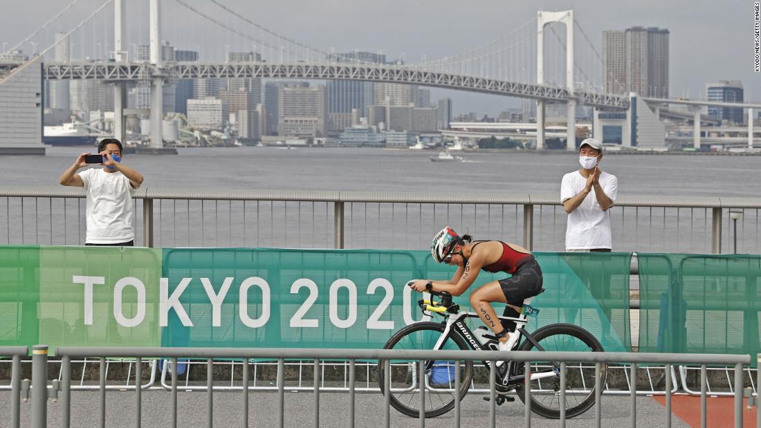 Japan&#39;s Mami Tani competes in the bike leg of the triathlon on August 29.