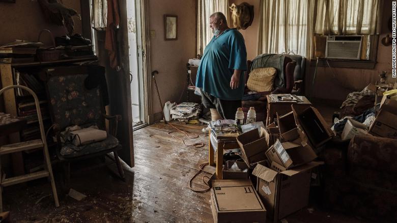Michael Wilson stands in the doorway of his flood-damaged home in Norco, Louisiana, on Monday, August 30.