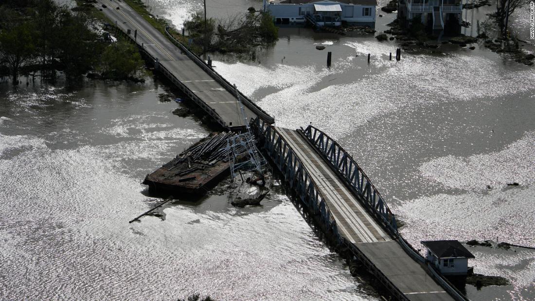 A barge damages a bridge connecting Lafitte and Jean Lafitte, Louisiana, on Monday.