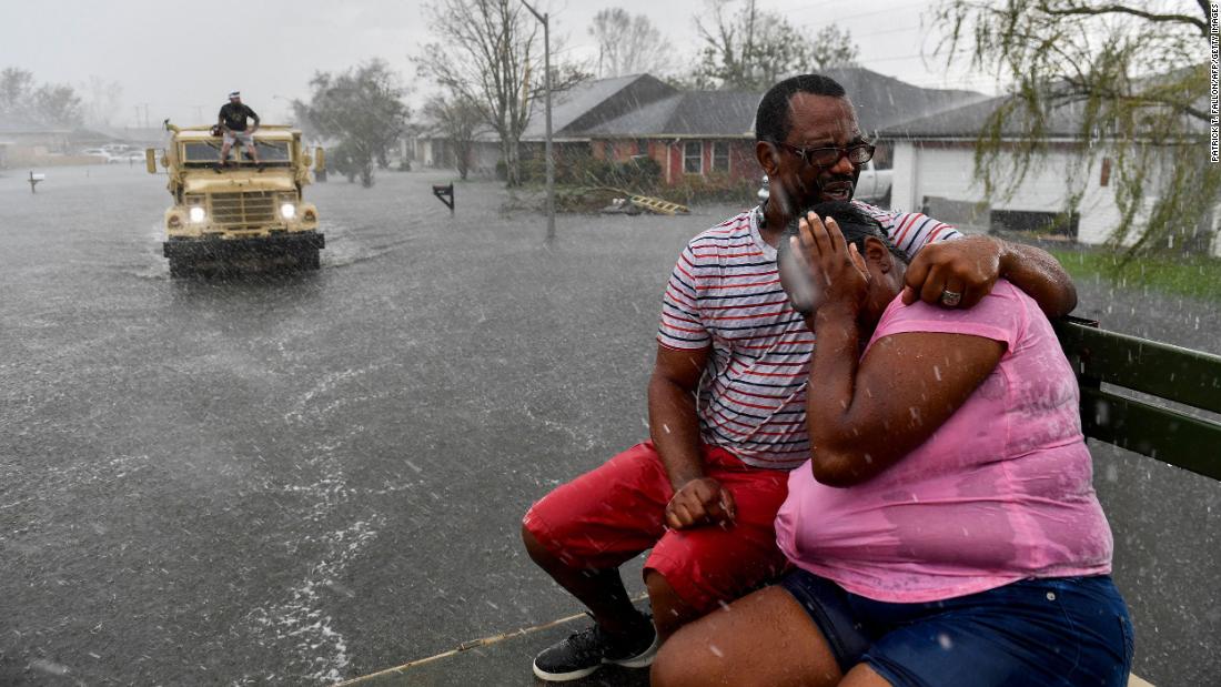 A rain shower soaks evacuees in LaPlace, Louisiana, on August 30.