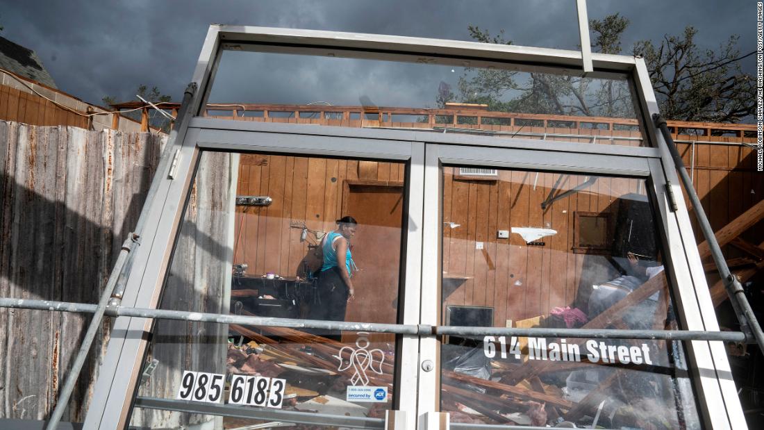 Marquita Jenkins stands in the ruins of her hair salon in LaPlace on August 30.