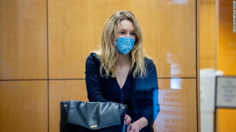 Holmes collects her belongings after going through security at the Robert F. Peckham Federal Building with her defense team on August 31, 2021 in San Jose, California. 