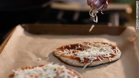 Sprinkling the mozzarella is also a good task to engage kids in the kitchen.