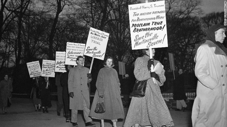 In this Jan. 30, 1951 file photo, demonstrators march in front of the White House in Washington, in what they said was an effort to persuade President Harry Truman to halt execution of the seven men.