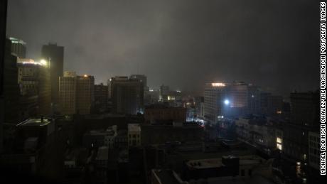 The downtown skyline in New Orleans is largely shrouded in darkness on Sunday night. The lights that are on are powered by generators. 