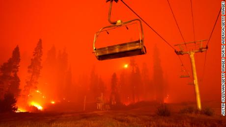 A chairlift at Sierra-at Tahoe ski resort sits idle as the Caldor Fire moves through the area on August 30, 2021 in Twin Bridges, California.
