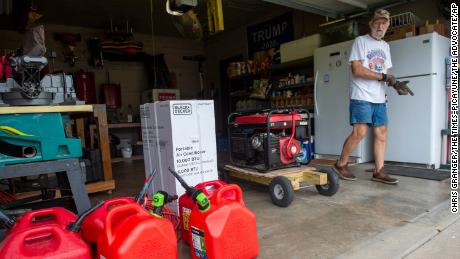 Mike Jackson of Morgan City, Louisiana, got extra gas tanks, multiple generators and a portable air conditioner as he and his family prepared to ride out Hurricane Ida on August 28. 