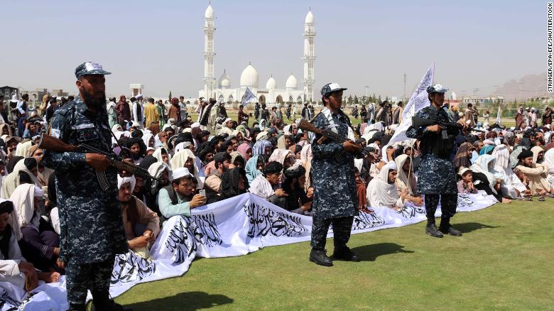 Taliban supporters gather to listen to the Taliban&#39;s governor for Kandahar province.