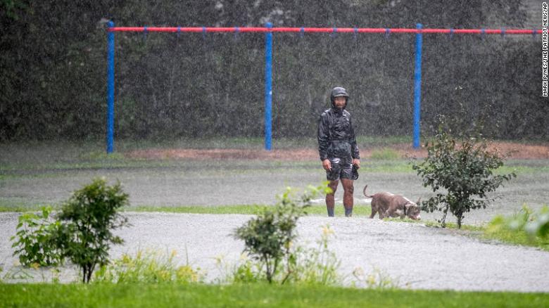 A man walks his dog in Camp Hill, Pennsylvania, on September 1.