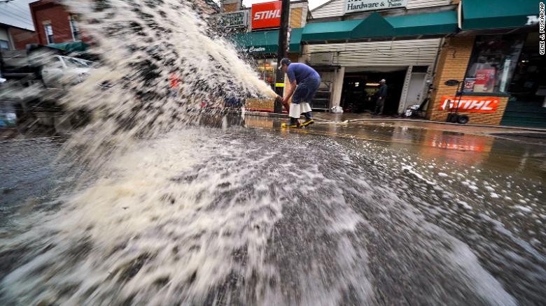 Water is pumped from the basement of a business on Noblestown road in Oakdale, Pennsylvania.