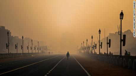 A man walks through New Delhi, India, amid smoggy conditions on January 28, 2021. 