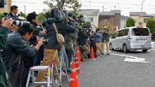 A car carrying Chisako Kakehi leaves the police station on November 20, 2014, in Muko, Japan. 