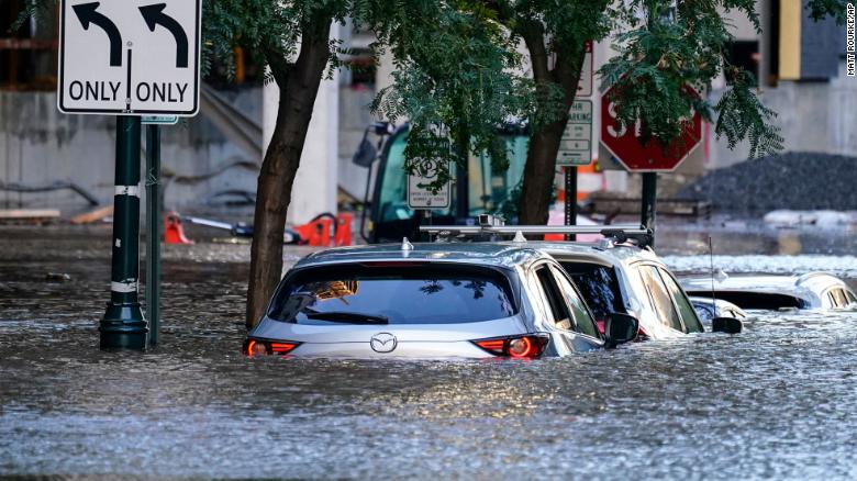 Vehicles are seen under floodwater in Philadelphia on Thursday. 
