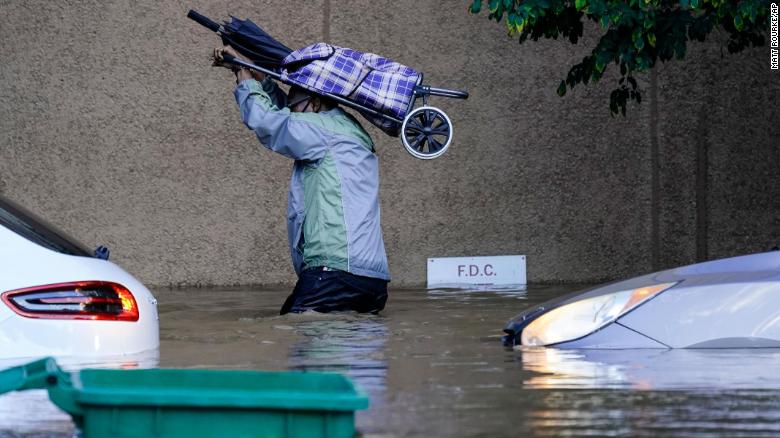 A person walks in floodwaters in Philadelphia on September 2.