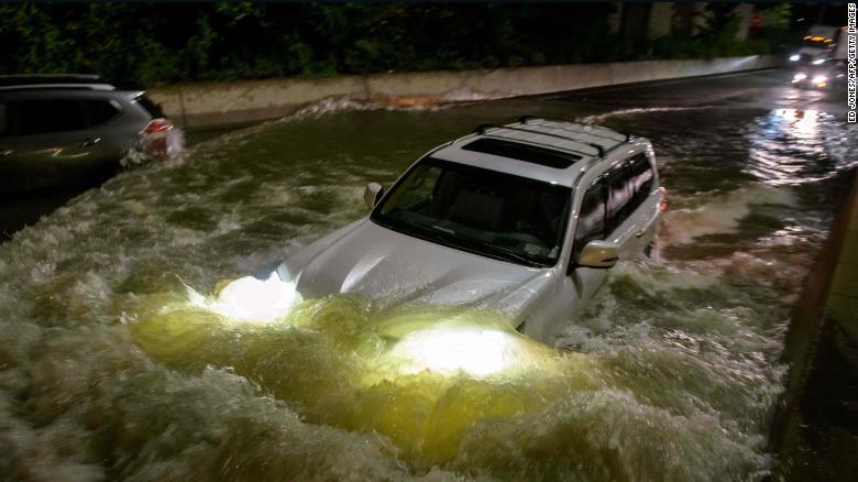 A motorist drives on a flooded expressway in Brooklyn, New York, early on Thursday, September 2, as the remnants of Hurricane Ida swept through the area.