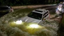 A motorist drives on a flooded expressway in Brooklyn, New York, early on Thursday, September 2, as the remnants of Hurricane Ida swept through the area.