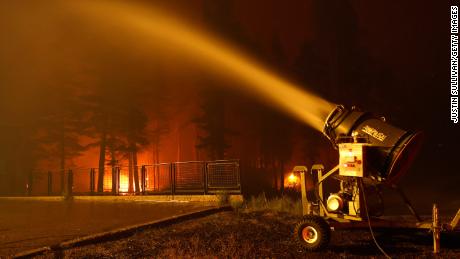 Lake Tahoe ski resorts are using snow blowers to help fight flames from the Caldor Fire