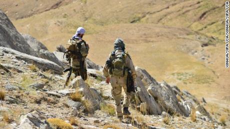 Anti-Taliban fighters patrol the Anaba District of Afghanistan&#39;s Panjshir province on September 1.