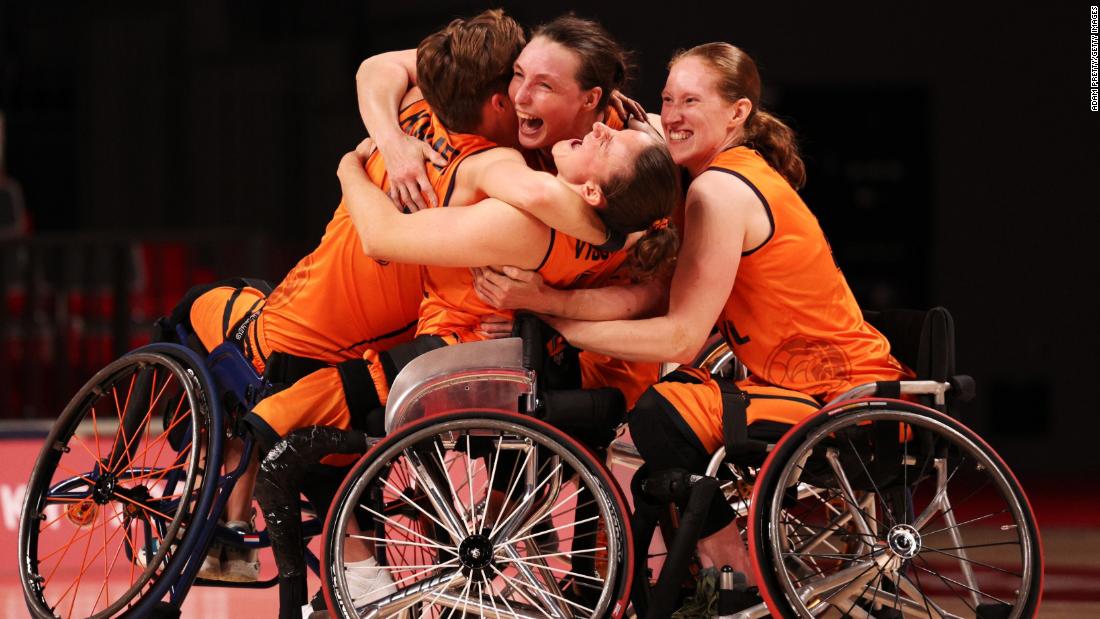 Wheelchair basketball players from the Netherlands celebrate after defeating Germany in a semifinal game on September 2.