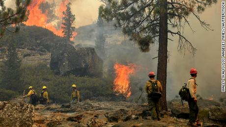 Firefighters are trying to fight a backfire to help fight the Caldor fire near Lake Tahoe on September 2, 2021.