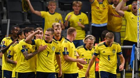 Sweden&#39;s players celebrate taking the lead against Spain. 
