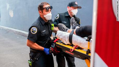 Paramedics respond to a heat exposure call during a heat wave on June 26, 2021, in the US city of Salem, Oregon.