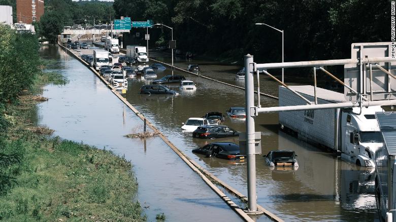 Cars sit abandoned on the flooded Major Deegan Expressway in the Bronx, New York, following a night of heavy wind and rain from the remnants of Hurricane Ida.