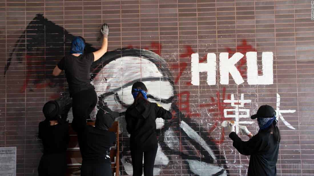 Graffiti on a wall at HKU during the 2019 siege reads &quot;revolution university.&quot;