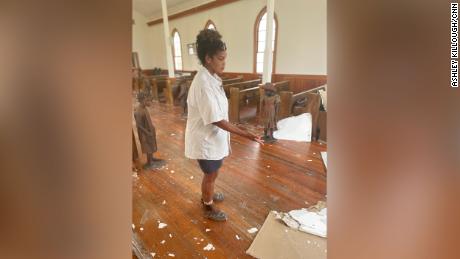 Joy Banner, the communications director at Whitney Plantation and a descendent of enslaved Africans, shows some of the damage to a church that was built by freed slaves on the plantation, which is now a museum.