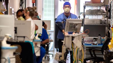 Northeast Georgia Medical Center critical care staff work with Covid-19 patients on Monday, August 30, 2021, in Gainesville, Georgia. Many hospitals are experiencing a surge in Covid-19 patients as the state set a new mark for infections.