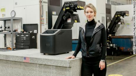 Holmes with a Theranos blood testing machine at the company&#39;s facility in Newark, California, in December 2015. 