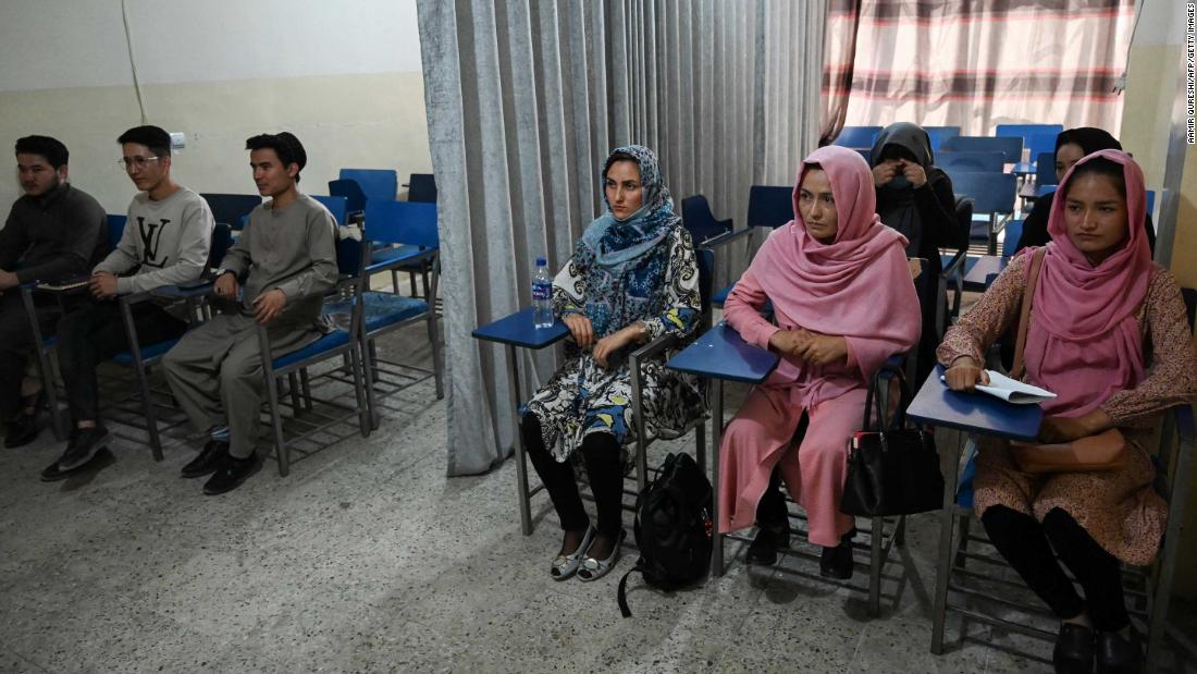 Curtains separate male and female Afghan students as new term begins under Taliban rule
