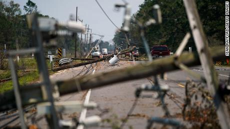 Downed utility poles lie on a road in Albany, Louisiana, on September 2.