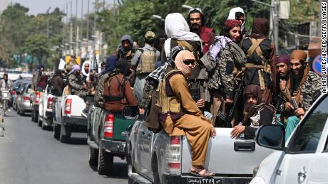 A convoy of Taliban fighters patrol along a street in Kabul on September 2, 2021.