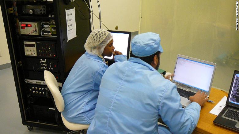 Astrofica's Jessie Ndaba and Khalid Manjoo testing SumbandilaSat, a South African micro earth observation satellite, in 2009.