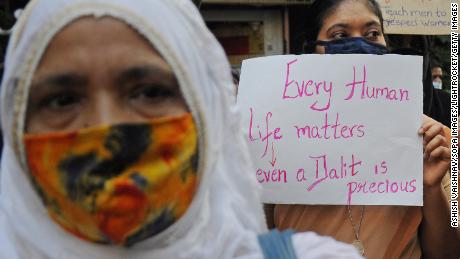 A woman in Mumbai protests in June 2020 against caste-based sexual violence happening in different parts of the country.