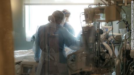 Nurses look after a patient in the ICU Covid-19 ward at NEA Baptist Memorial Hospital in Jonesboro, Arkansas, on August 4, 2021.