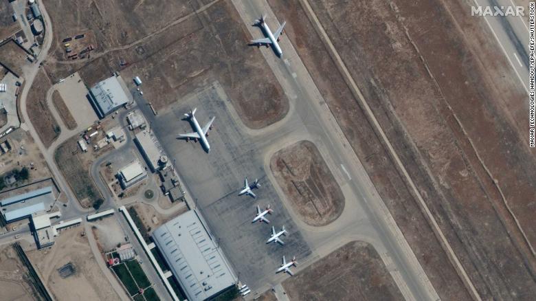 A handout satellite image made available by Maxar Technologies shows airplanes near the main terminal at Mazar-i-Sharif Airport, northern Afghanistan, on September 3, 2021.